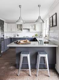 Ahead are 30 examples of two tone kitchen cabinets that make a strong case for abandoning uniformity. White Upper Cabinets Dark Lower Cabinets Contemporary Kitchen Est Magazine