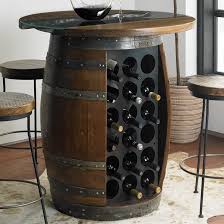 This imaginatively designed piece includes a barrel on the bottom, with a sunken top that allows you to place food, drinks and serving items out of your guests' way. Loire Wine Barrel Pub Table With Glass And Wood Top