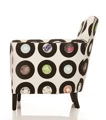 the print consists of various vinyl singles against a white background with the labels of each record adding funky armchairs printed chair upholstery fabric