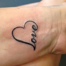 Simple Love Tattoo Quotes On Wrist Combined With Heart Love Tattoo Quotes Love Wrist Tattoo Tattoo Designs For Girls Tattoos