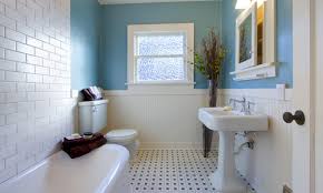 The rough brick wall and unfinished wood table of this space contrast with the smooth, geometrical look of the washbasin and mirror. 31 Stylish Bathroom Window Ideas