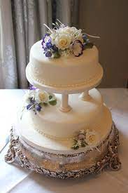 A Two Tier Cake With Pillars And Icing Flowers To Create This Beautiful Finish By Inspired Icing Fi Cake Pillars Classic Wedding Cake Tiered Cakes Birthday