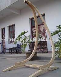 It's built of 2 straight square posts with black candle holders as finials, long bottom stretchers, 4 feet, 2 diagonal girders. Diy Hammock Swing Chair Stand Diy Lapes