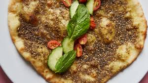 We started serving these with hummus or here's how to make flatbread: Middle Eastern Flatbread The Ultimate Community Builder Bon Appetit