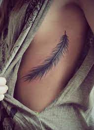Feather Tattoo On Rib Cage Girly Tattoos Feather Tattoos Tattoos