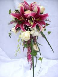 The orange oriental lilies would work in this style of bouquet with some light white blossoms. Pin On Wedding Flowers