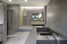 Modern bathroom pictures and photos for your next decorating project. Large Modern Bathroom With Mosaic Tile Bathtub Stock Photo Dissolve