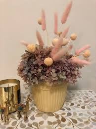 Arranging dried flowers in vase. Decor Blush Dried Flower Arrangement With Butter Vase