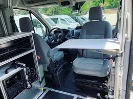Swivel Seat With Modular Lagun Pivot Table In Vandoit Camper Van Built On The Ford Transit 350 Xlt In 2020 Ford Transit Custom Camper Vans Van Life