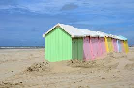 Beach huts that once stood proudly facing the sea, crumbled under the weight of the waves. Beach Hut Wikipedia
