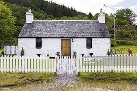 Quaint Traditional Highland Stone Bungalow Cottage With White Paling Cottage Stone Cottage Cottage Design