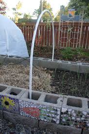 Check spelling or type a new query. Diy Season Extension Pvc Hoop House Cinder Block Garden Raised Garden Garden Design
