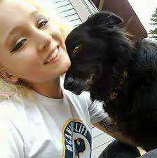 A girl and her emotional support dog finally together again at college