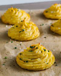 Cheesy Garlic Duchess Potatoes Are The Fancy French Side You Need Recipe Duchess Potatoes Recipes Potatoes