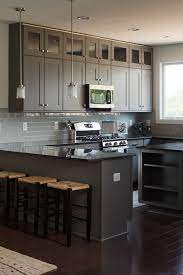 Cabinets and cupboards are an essential piece of furniture for every home. These Glass Front Kitchen Cabinets Extend To The Full Height Of The 9 Foot Ceilings In T Cabinets To Ceiling Kitchen Cabinets To Ceiling Cheap Kitchen Cabinets
