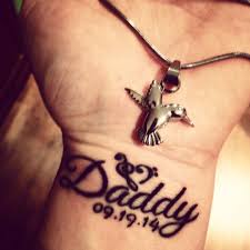 The eagle is just like the navy seal team emblem, but instead of being on the navy anchor, dustin put him on the cross in memory of his dad being saved before he died. Memorial Dad Wrist Tattoo Wrist Memorial Tattoos For Son