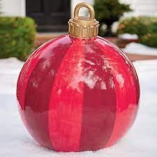 There is no missing these cardboard ornaments on the wall. These Oversized Christmas Ornaments Make Outdoor Decorations Stylish Again