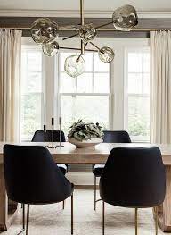 Shaker restraint, but on the west coast. Black Leather Dining Chairs With Light Brown Oak Dining Table Transitional Dining Room