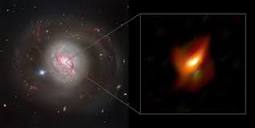 Supermassive black hole caught hiding in a ring of cosmic dust | ESO