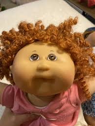 I've been looking for a cabbage patch doll like this for the longest and  haven't had any luck. Does anyone know what company made her? I know she is  a #18 head