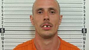 Man arrested in Miner motel hostage situation has died