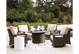 Ow lee sets the standard for telescope casual furniture offers marine grade polymer, rustic polymer and aluminum slat fire tables available in a. Signature Design By Ashley Paradise Trail Outdoor Fire Pit Table Set Lindy S Furniture Company Outdoor Conversation Sets Outdoor Chat Sets