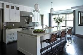 In this kitchen, the natural cream and beige hues work with the gray flecks in the countertop to pull together the suede grey cabinets, as well as the beautiful mosaic backsplash. Gray Kitchen Backsplash Contemporary Kitchen Mar Silver Design