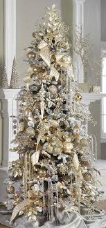Christmas tree decorating started way back in 16th century germany, and has since been carried on as a this silver tree features silk flowers, leaves, small balls, bead strings, flowing feathers, and the just the color scheme is a regal combination of traditional christmas gold and red that stands out. 20 Amazing Christmas Decorations In Silver And Gold Decor Home Ideas