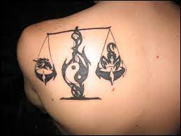 A libra tattoo of tribal influence loudly and proudly sunk into skin. Libra Tattoos Inkdoneright Com Libra And Scorpio Together Tattoos Pinterest
