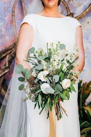 The flowers were absolutely breathtaking. Modern Wedding Bouquet Greenery Bouquet With White Flowers Mollie Crutcher Photography Modern Wedding Bouquets Wedding Wire Wedding Modern