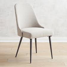 This dining chair, with its elegant low curved back and comfortable leather seat, is the perfect addition to any modern home. Rissa Mod Curved Brown Linen Tapered Dining Chair