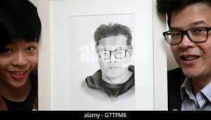 Ethan Cheung, 13, from Bangor, with father Allen Cheung, with his piece  'Portrait of my Dad' which won him 3rd prize in category C, in the 61st  Texaco Children's Art Competition, during