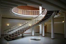 The sides are cut from 5 cm (two inch) steel plate, painted a dark grey; Flowing Staircase Design Photo By Photographer Daniel Fisker Arne Jacobsen Modern Staircase Stairs