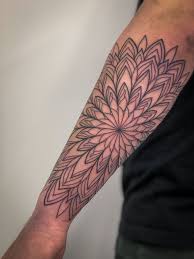 They consist of geometric figures, including layers of circles and squares. Geometric Tattoo Art The Redhawk Studio Remy Robards Blackwork Linework Colorwork Houston Tattoo Artist