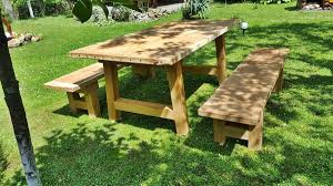 A bench is graced by comfortably padded seats in a medium brown microfiber fabric upholstery with turned legs. Casa Padrino Garden Furniture Set Rustic Table 2 Garden Benches Length 200 Cm Oak Solid Wood Real Wood Furniture Solid