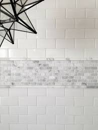 Don T Be Afraid Of Mixing Materials This Is Carrara With Ceramic Subway Tile The Pencil Helps Deal Bathrooms Remodel Bathroom Design Bathroom Tile Designs