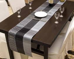 Be sure to check out runners that can also be used on bedroom dressers, coffee tables, pianos or the mantle. Attractive And Modern Dining Table Runner Design Ideas