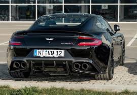 A chevron arrow pointing down. Aston Martin V12 Vanquish S Aston Martin V12 Aston Martin Lagonda Aston Martin Vanquish