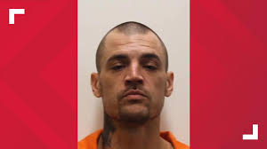 Freeburg police find woman dead, man charged