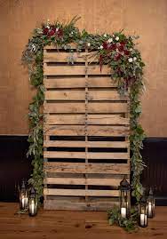 Rustic Skid Repurposed For A Wedding Ceremony Venue The Warehouse At Cork Factory Hotel In La Christmas Photo Booth Rustic Wedding Decor Christmas Backdrops