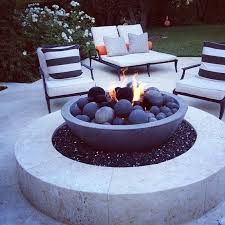 A Modern Bonfire Space Of White Stone With An Eye Catchy Firepit With Stone Balls Backyard Outdoor Fire Pit