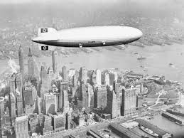 Rppc zeppelin and goodyear blimp 1930 las angeles. Hindenburg Flying Over Lower Manhattan Photographic Print Art Com In 2021 Airship Hindenburg Hindenburg Disaster