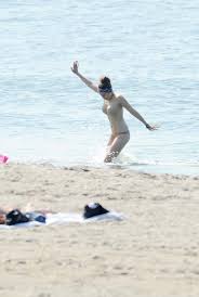 Elizabeth olsen at the beach. Elizabeth Olsen Waded In A Bikini Dakota Fanning And Elizabeth Olsen Sport Strapless Bikinis On Set Popsugar Celebrity Photo 3