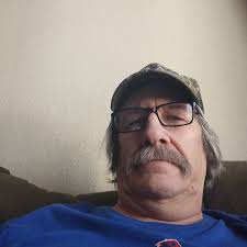 Silver truck hits green car at Lowe's parking lot