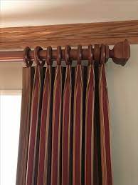 Dark Red Striped Curtains Hung From A Wooden Curtain Pole Smart Euro Pleat Heading Modern Curtain Rods Curtains Modern Curtains