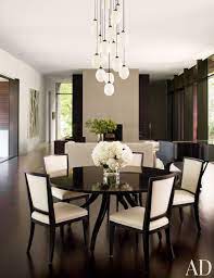 This beautiful round dining table with antique oak finish pairs perfectly with any reclaimed wood or mixed media dining room decor. 19 Round Dining Tables That Make A Statement Architectural Digest