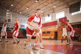 While the four quarters that make up a football game are 15 minutes long, the standard halftime is 12 minutes long. Men Playing Basketball Inside Gym Free Stock Photo