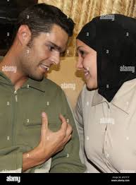 Aid worker Michael Leighton Phillips of Mandeville, La. ,left, speaks with  an unidentified colleague after being released in the West Bank city of  Nablus, early Thursday, Oct. 12, 2006. The American volunteer