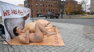 PETA protestor goes nearly nude for vegan Thanksgiving - YouTube