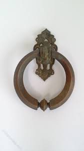 Some door knockers (also spelled doorknockers) were designed in the shapes of faces and animal heads, while others were fashioned in the prevailing style of the day, from arts and crafts to art. Antiques Atlas Victorian Bronze Door Knocker